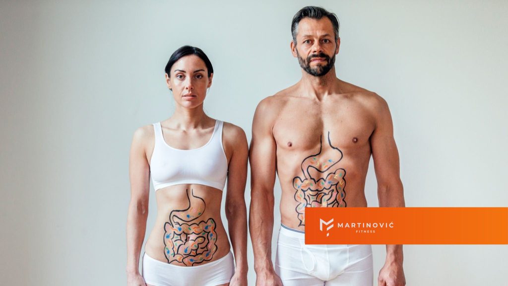 Na slici su prikazani muškarac i žena na čijim telima je oslikan sistem za varenje - kao naslovna slika bloga na temu kako se rešiti nadutosti.